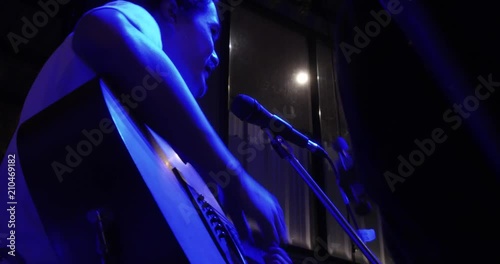 Musician in the restaurant. Bangkok, Thailand. musician play and sing the music for customer to come have dinner in the restaurant at night.