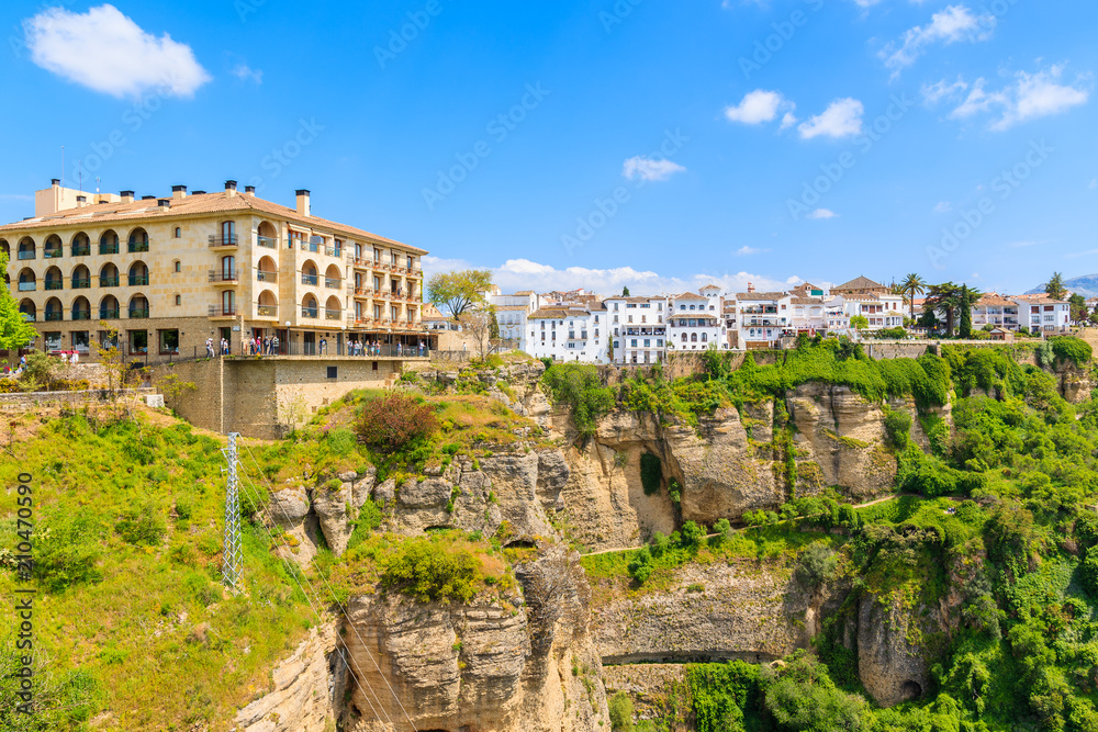 Historic buildings and white houses on cliff in Andalusian village of Ronda, Spain