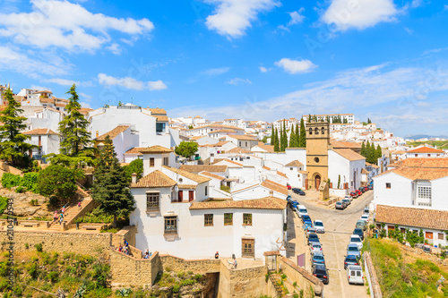 Church building on square and white houses in Andalusian village of Ronda, Spain © pkazmierczak