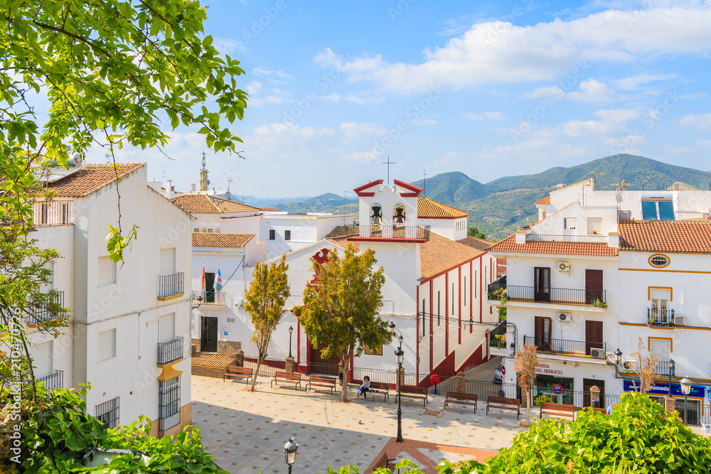 ANDALUSIA, SPAIN - MAY 10, 2018: Square with church and white houses in small white village. Olvera is located at the tip of the 