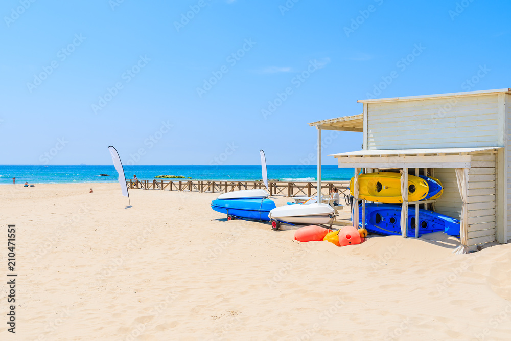Fototapeta premium Colorful kayaks on sandy Tarifa beach, Andalusia, Spain