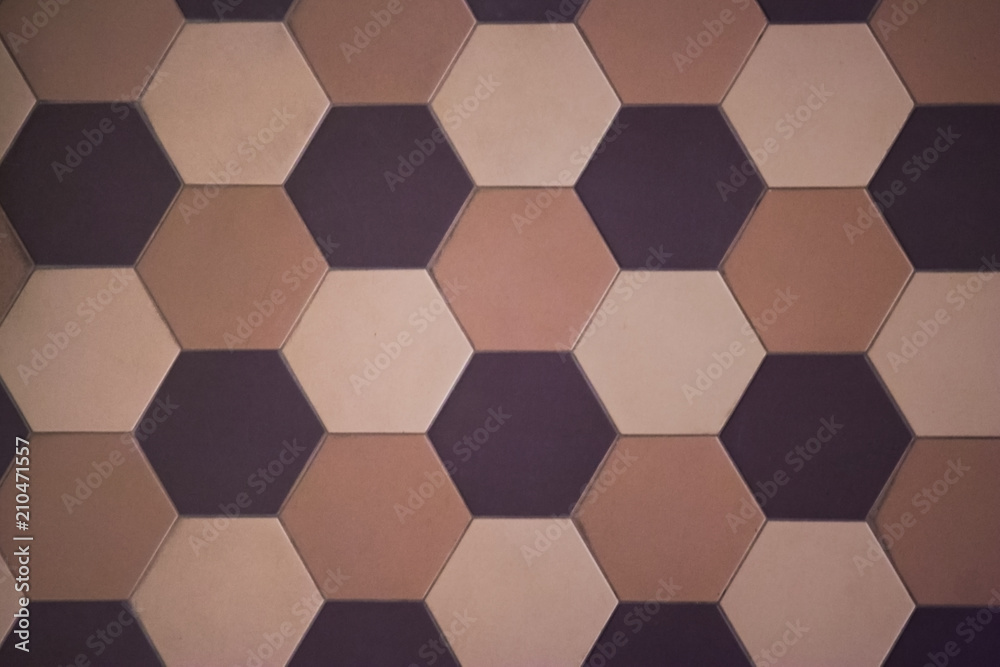 Hexagonal tiles on the wall or floor of a warm color scheme. Modern, fashionable tiles are often used in modern interiors Hexagonal tiles on the wall or floor of a warm color scheme. Modern, fashionable tiles are often used in modern interiors