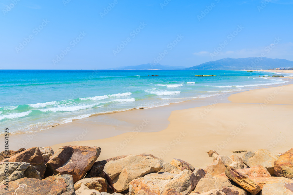 Sea waves on sandy Tarifa beach, Andalusia, Spain Sea waves on sandy Tarifa beach, Andalusia, Spain
