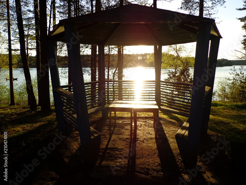 View of the lake and pavilion in the lakeside during sunset © Leoco