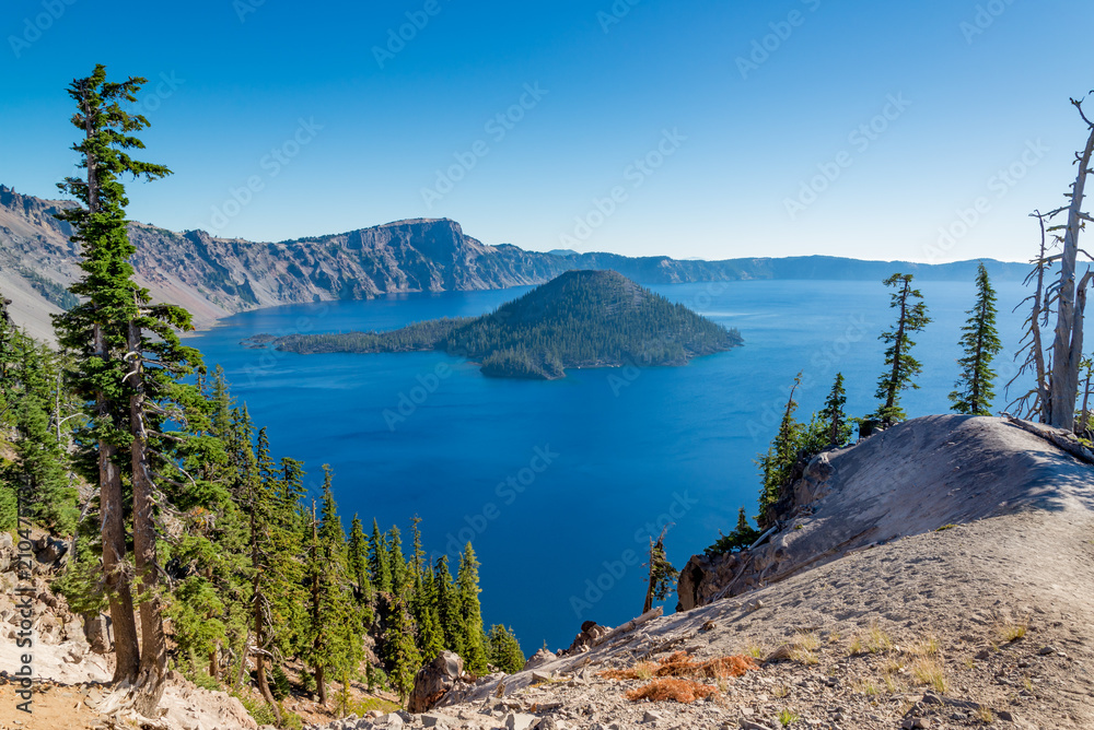 Crater Lake framed by trees in the summer