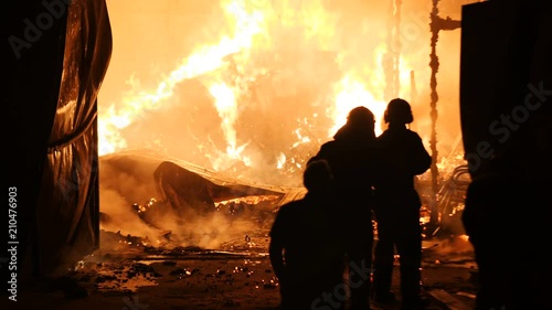 Firefighters Battling A Fire Closeup Slow Motion 4K