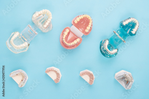 dentist tools and orthodontic on the blue background, flat lay, top vipw.