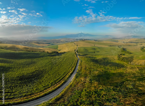 Gladiator Road with cypress trees in the Val d orcia (Orcia Valley) towards Terrapille - near Pienza in Tuscany, Italy - cypress trees along the famous white road, or strada bianca - Aerial view