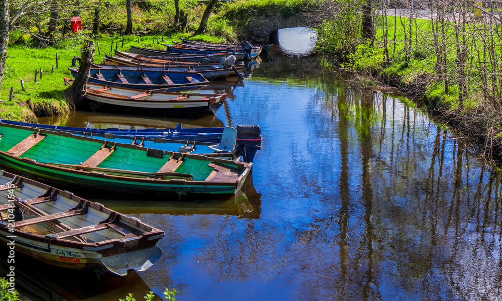 Small boats lying in a creek of Killarney National Park in Ireland