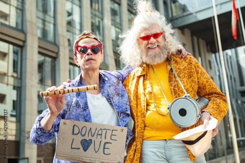 Bizarre hippies. Two bizarre elderly hippies feeling unbelievably amazing while performing in the street photo