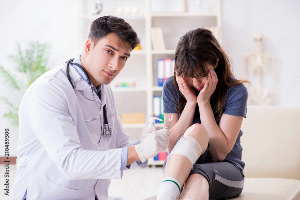 Fototapeta premium Patient visiting doctor after sustaining sports injury