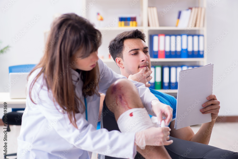 Patient visiting doctor after sustaining sports injury Patient visiting doctor after sustaining sports injury
