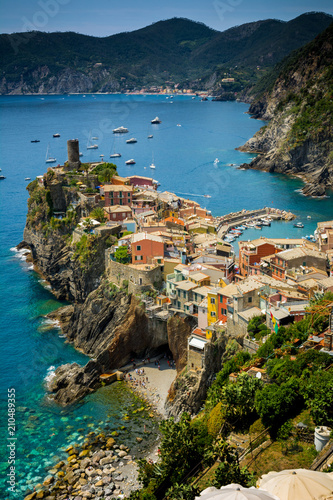 Vertical View of the Town of Vernazza on blue Sea and the Coastline of the Liguria Background.