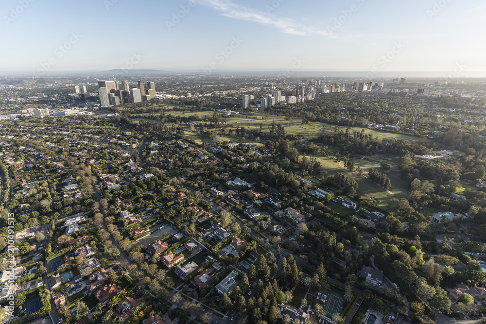Obraz premium Aerial view of Beverly Hills residential streets with Century City and Westwood skylines in background in Los Angeles California.