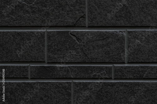 Black stone tile wall pattern and background