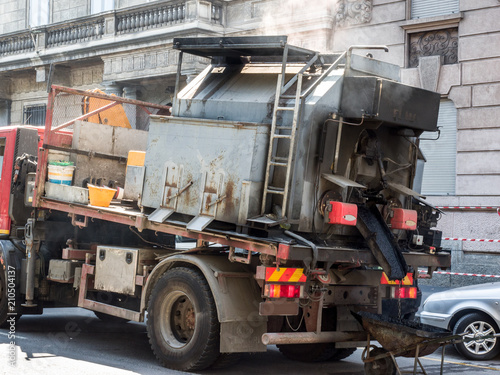 truck used for the repair of the road surface.Milan, Italy