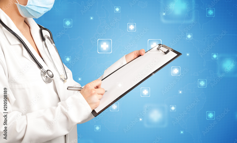 Female doctor holding notepad with blue background and crosses Female doctor holding notepad with blue background and crosses