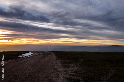 Subasio Mt. (Umbria, Italy), with sky covered by clouds and warm sunset colors