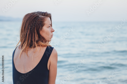 Woman alone and depressed sitting at the beach © marjan4782
