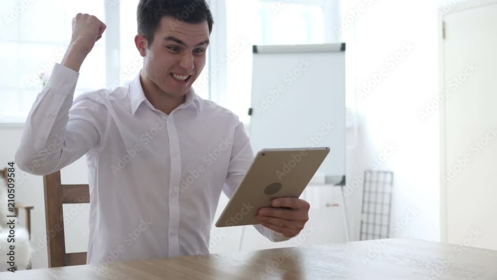 Businessman Using Tablet for Business and Celebrating Success Businessman Using Tablet for Business and Celebrating Success