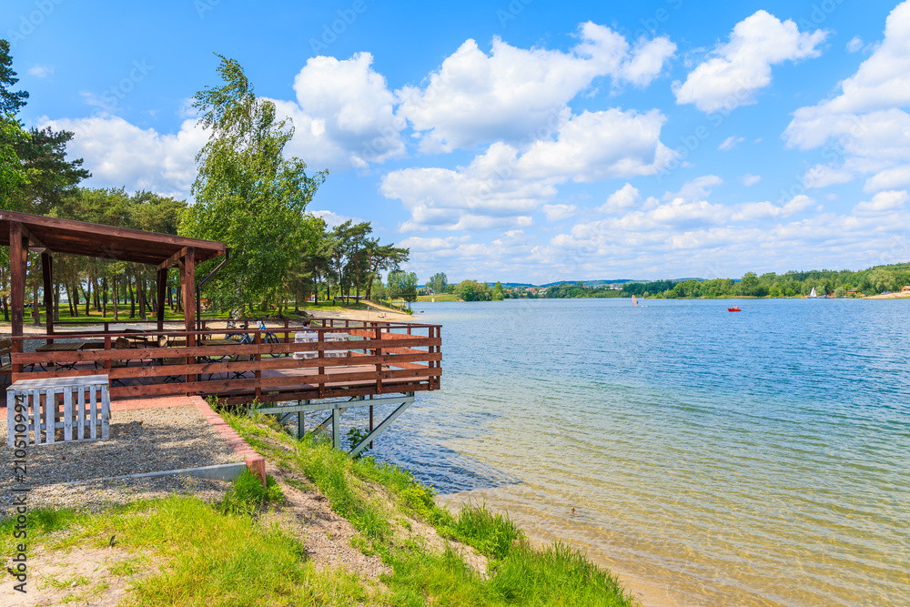 Restaurant terrace on beach on sunny beautiful summer day, Kryspinow lake near Cracow city, Poland
