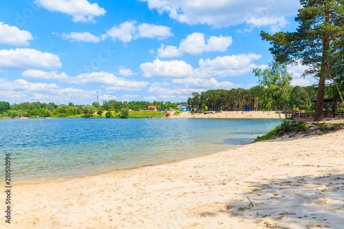 Sandy beach on sunny beautiful summer day, Kryspinow lake near Cracow city, Poland