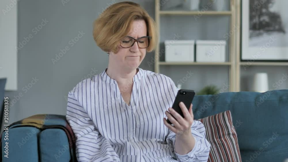 Old Senior Woman Upset for Loss while Using Smartphone Old Senior Woman Upset for Loss while Using Smartphone