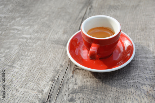 Morning espresso red cup cooffee on wooden table