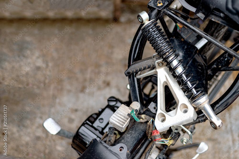 Fototapeta premium motorcycle repair with soft-focus and over light in the background