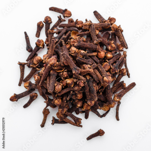 fragrant cloves on a white acrylic background