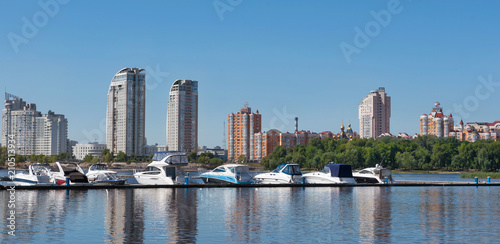 Kiev, Ukraine - June 01, 2018 : Sailing yachts and private boats on a pier in the river. yachts in the gulf in river port in the downtown.