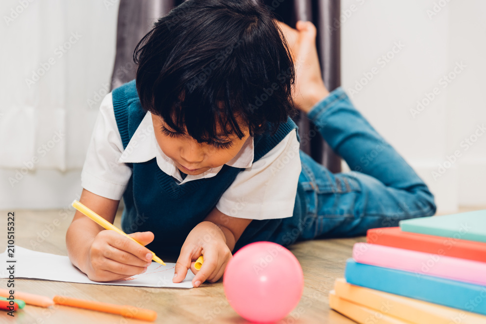 Happy child kid boy kindergarten drawing on peper teacher education Happy child kid boy kindergarten drawing on peper teacher education