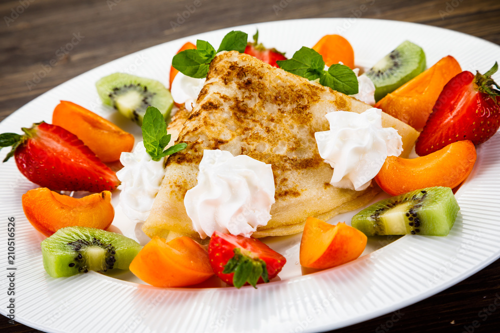 Crepes with fruit and creme Crepes with fruit and creme