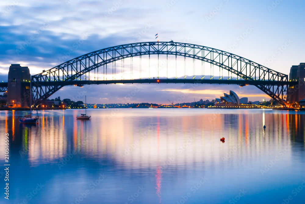 Mighty construction of harbor harbour bridge during sunset sky to downtown city center centre Sydney for holiday and couple romantic honeymoon