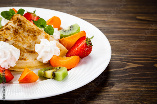 Crepes with fruit and creme