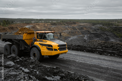 Articulated dump truck on the road in an open coal mine. © Валентин Копалов