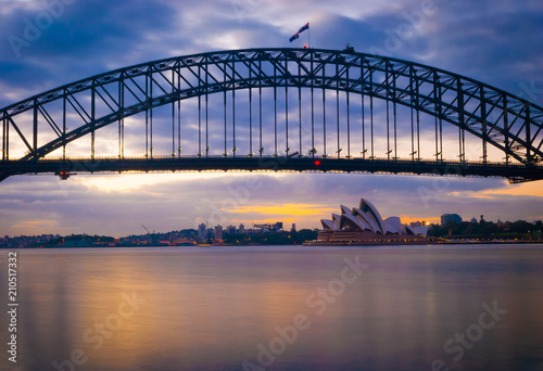 Mighty construction of harbor harbour bridge during sunset sky to downtown city center centre Sydney for holiday and couple romantic honeymoon