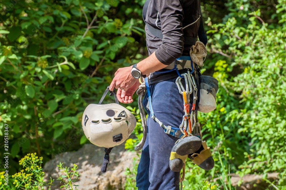 Obraz premium Rock climbing. Climber close-up in working outfit. Extreme sport.