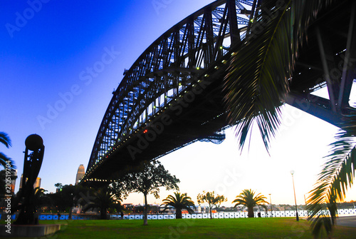 Mighty construction of harbor harbour bridge during sunset sky to downtown city center centre Sydney for holiday and couple romantic honeymoon