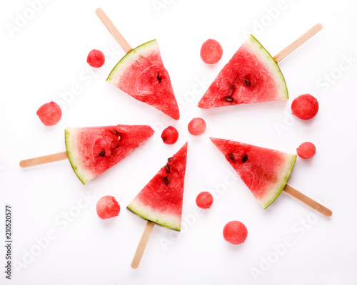 Watermelon slice popsicles on white background.
