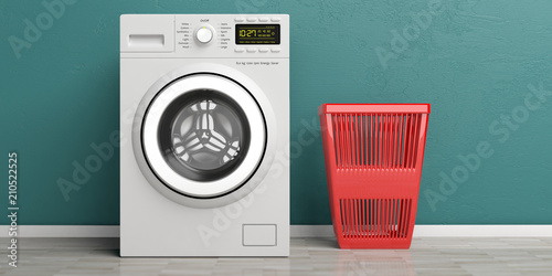 Tableau sur toile Clothes washer, dryer machine and red laundry basket on wooden floor, green wall background