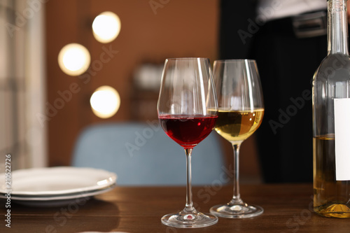 Glasses with tasty wine on table in restaurant