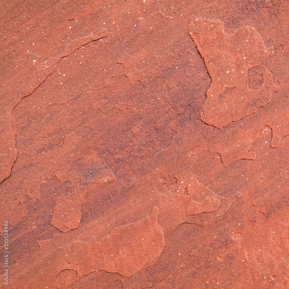 Fototapeta premium Red rough stone texture background. Material construction and architectural detail.