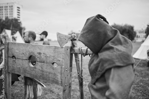 The executioner stands near the scaffold