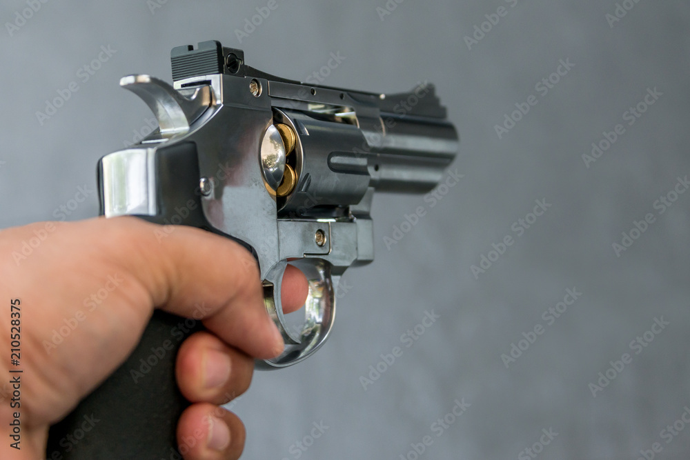Man holding gun revolver pistol in shooting