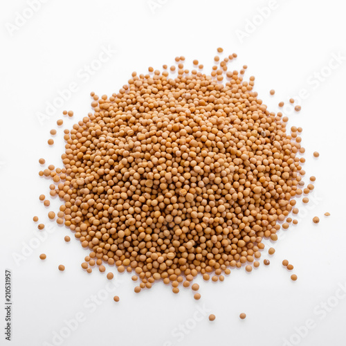 fragrant grains of mustard on a white background