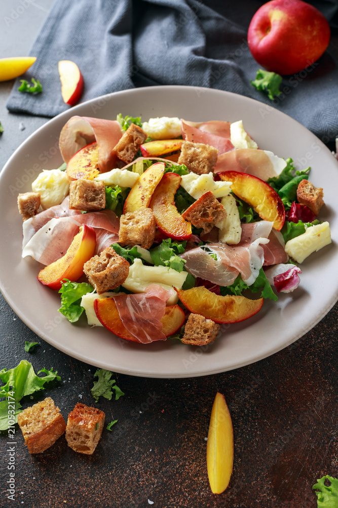 Fresh grilled peach salad with green mix, cheese, prosciutto and crouton Fresh grilled peach salad with green mix, cheese, prosciutto and crouton