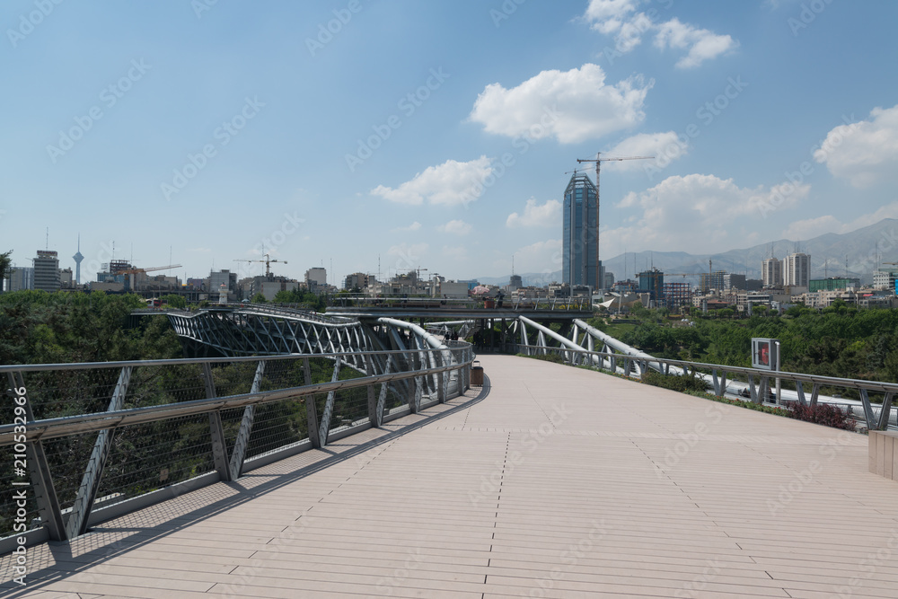Tabiat pedestrian overpass designed by Leila Araghian. Tabiat steel bridge connects two public parks by spanning the Modarres highway in northern Tehran.