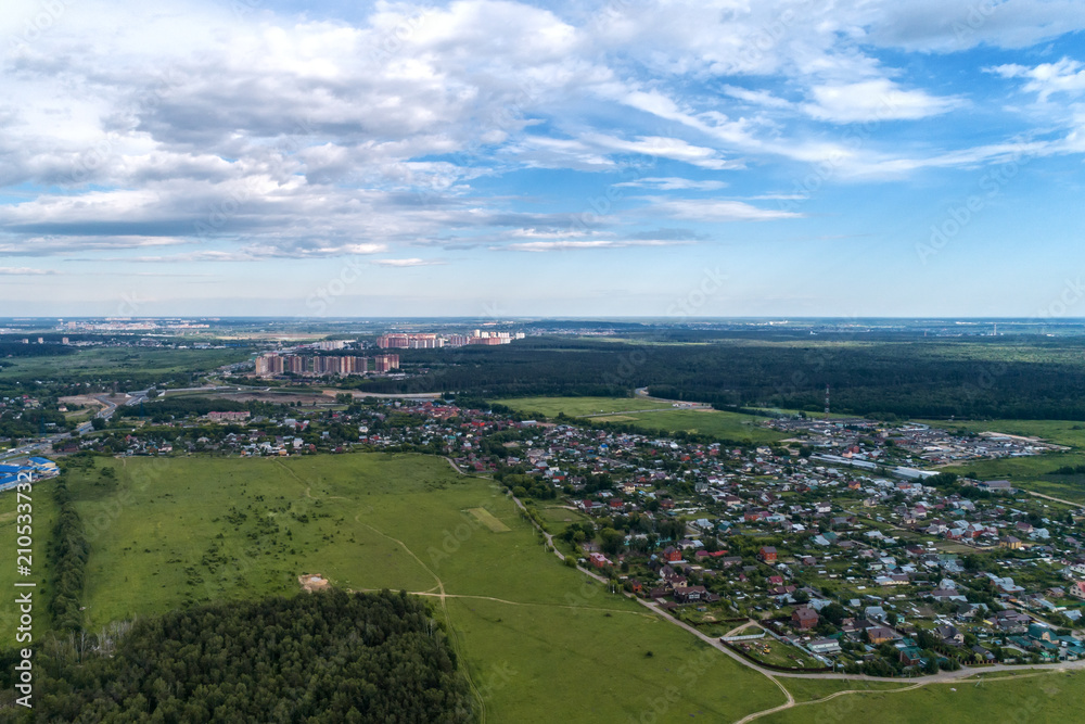 Aerial view of wheat fields, meadow, forest and village in rural Russia. Aerial view of wheat fields, meadow, forest and village in rural Russia.