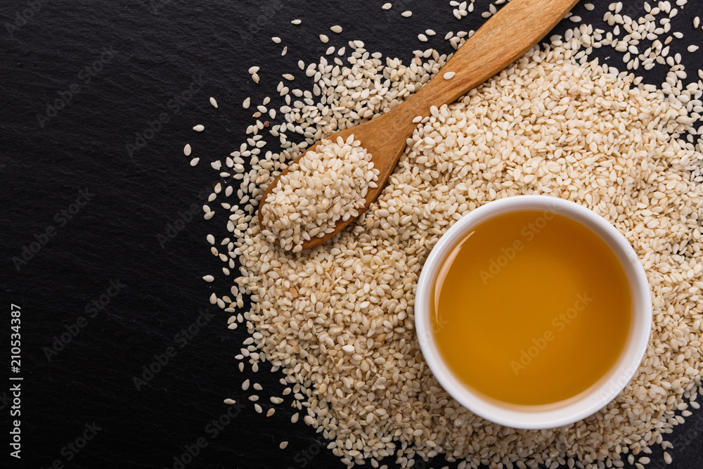 fresh sesame seeds on a rustic background fresh sesame seeds on a rustic background